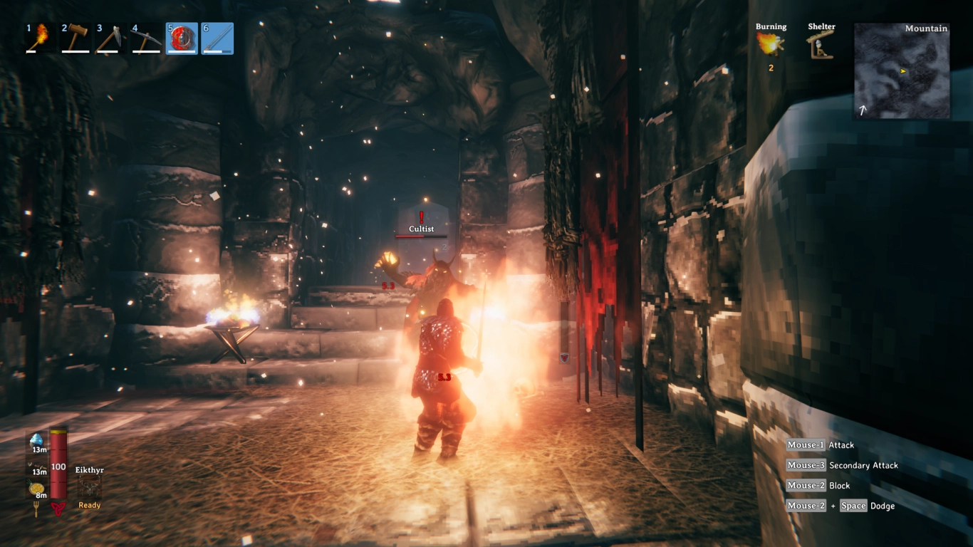 Cultists in red robes casting fire spells inside a Frost Cave in Valheim